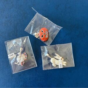 Set of 3 charm bracelet pieces, including a pumpkin, turkey, and rabbit